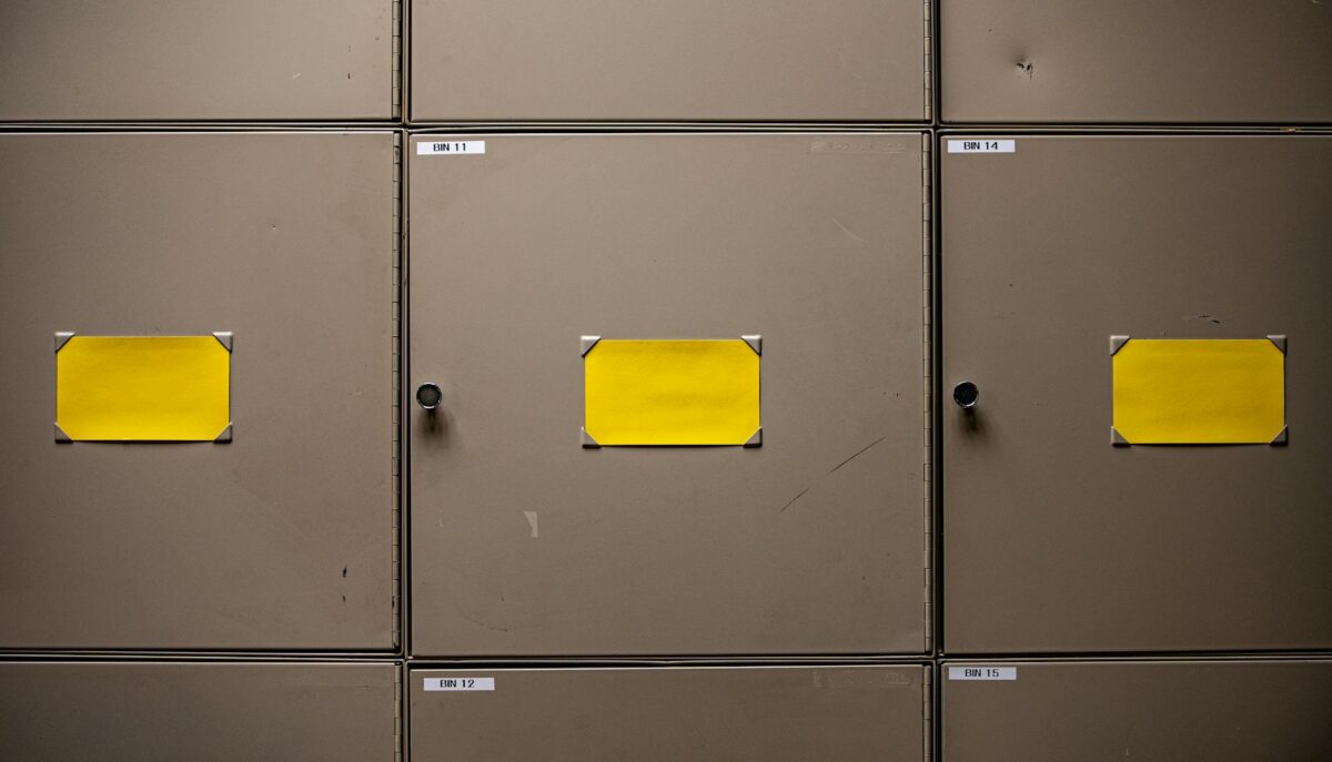 yellow paper on gray metal cabinet